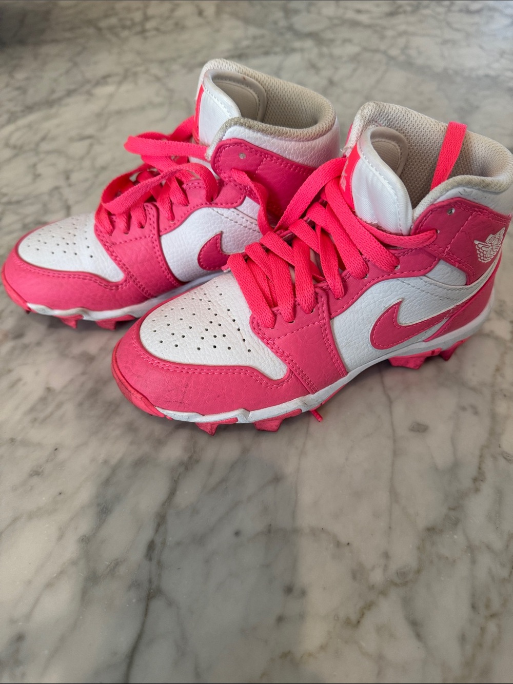 Kids Pink and White High-Top Nike Air Jordan FastFlex lacrosse cleats